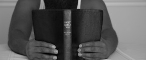 man praying with bible